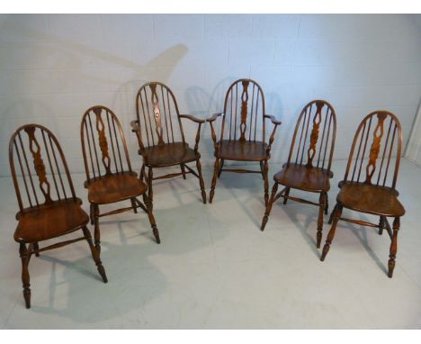 Set of six Elm and Beech Glenister dining chairs with stick backs. (Two include two carvers)