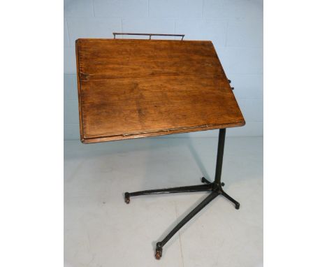 Edwardian Adapta reading table on cast iron base with oak tray.