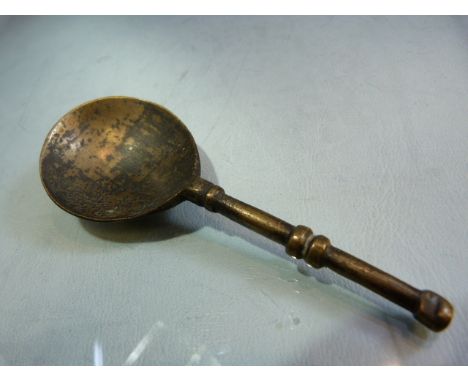 Early Bronze spoon with large bowl and simplistic banded handle. 