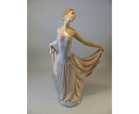 Lladro - figure of a ballerina, head tilted back and holding dress up 