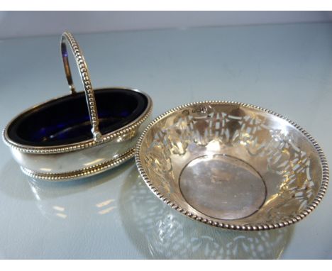 Hallmarked silver salt with blue glass liner London 1819 maker Hyam Hyams. Along with a small pierced trinket bowl Birmingham