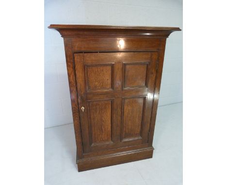 19th Century oak cupboard of small size with bracket feet and ivory escutcheon 