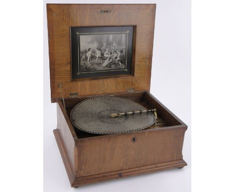 A 19th century walnut cased Polyphon,with marquetry panelled lid, playing 40cm discs, in working order, cabinet width 54cm to