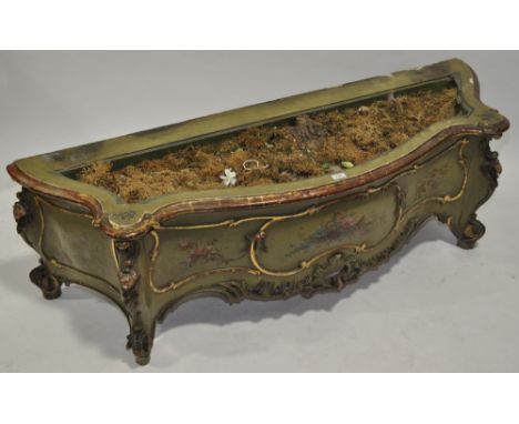 A 19th century Italian painted planter of serpentine form,with fitted liner and carved and painted decoration, length 5'2", h