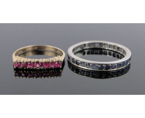 A 14ct gold ruby set ring,and a sapphire eternity ring, (2).