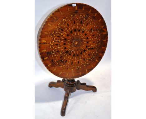 A Victorian walnut and inlaid circular tilt top table,raised on turned base and tripod legs, width 2'7", height 2'4".