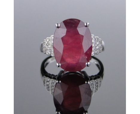 A 14ct white gold 9.7ct ruby ring,small diamond set shoulders, total diamond content approx. 0.25cts, size N.