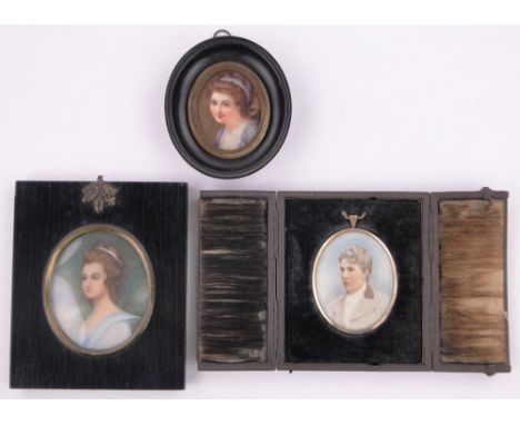 A 19th century miniature continental porcelain plaque,with painted portrait of a young woman, original ebonised frame, overal