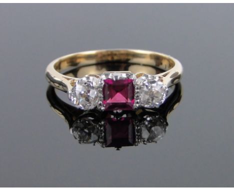 An 18ct gold square-cut ruby and diamond 3 stone ring,setting width 12mm, size K.