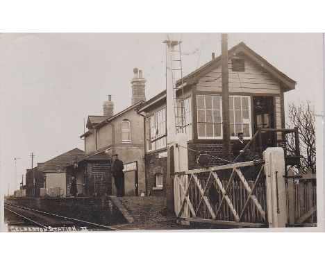 Postcard-Geldeston Railway Station (Norfolk) - Fine RP (Superb) dated 1912 used, signal box, crossing gate, platform activity
