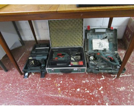 3 power tools in cases