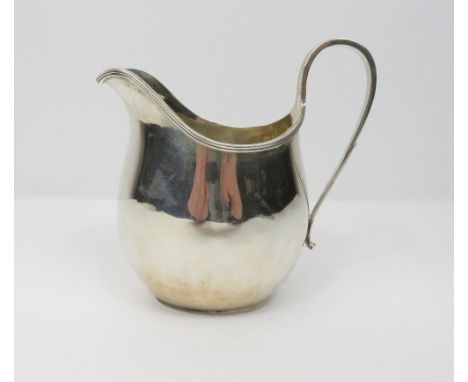 A silver helmet shaped cream jug, by J.B. Chatterley &amp; Sons Ltd, London 1929, of plain Georgian style, 11 cm high, 149g (