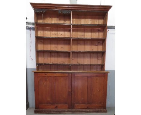 A 20th century dresser with open shelf top section and two door cupboard section, 230cm high, 164cm long, 54cm deep