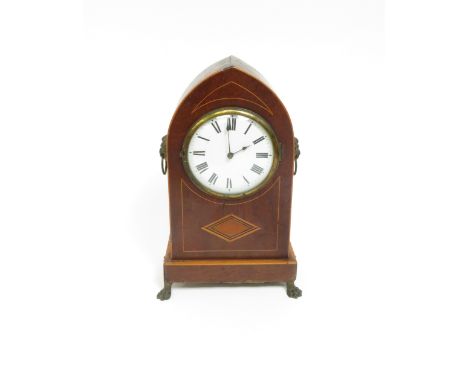 A 20th century oak lancet cased timepiece, along with an oak cased mantel clock