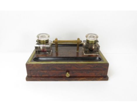 An early 20th century mahogany inkwell with two glass inkstands