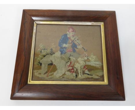 A 19th century needlework of man playing a violin seated on a bench with dog, in a rosewood veneer frame, 16.5cm x 19cm