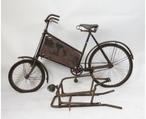 A vintage black painted advertising bicycle