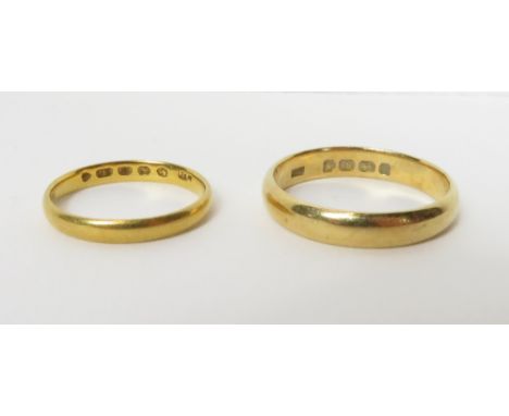 A plain 22 carat gold wedding ring, 2 g gross; with an 18 carat gold plain wedding ring, 4.2 g gross, cased