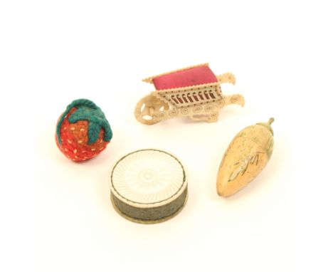 Three pincushions and an emery, comprising a bone pierced side wheelbarrow, cracks to wheel, 5.5cm, a mother of pearl disc fo