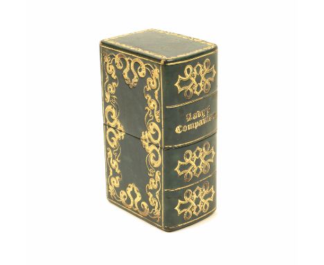 A leather cased 'Lady's Companion', in blue leather with gilt tooled decoration and titled to the spine, the interior with ta