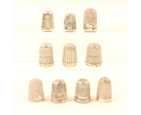 Ten English silver thimbles, most with decorative borders, all hallmarked. (10)