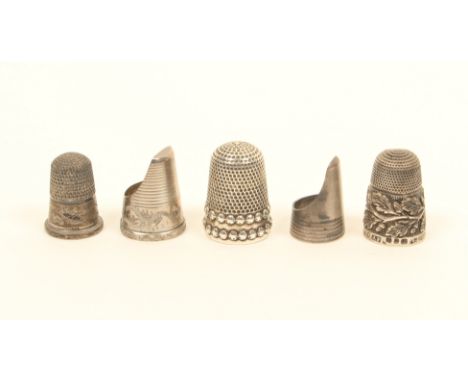 Five English silver thimbles, comprising; an example with double dot rim, makers mark 'HW', another with oak leaf and acorn b