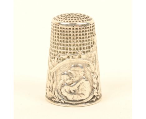 A French silver thimble, 'Armistice of 1918', with three figural panels, the larger signed 'Lasserre', light scratching.