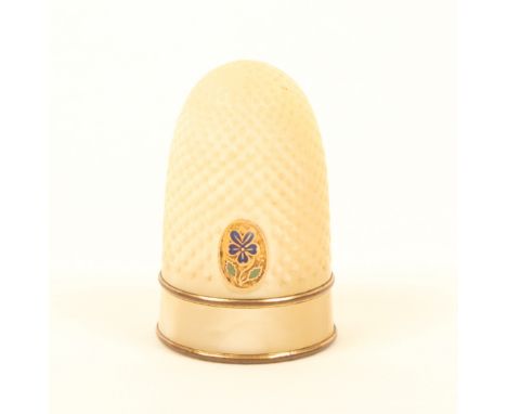 A Palais Royal thimble, in mother-of-pearl with gilt metal and enamel pansy motif above a plain freeze, banded by gilt border