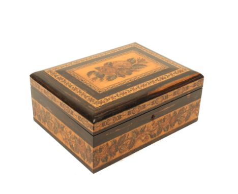 A Tunbridge ware coromandel sewing box by Edmund Nye, of rectangular form, the cushion lid with an inset mosaic panel of flow