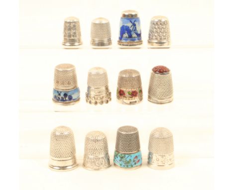 Twelve silver and white metal thimbles, including three continental examples with enamelled decoration, another by James Swan