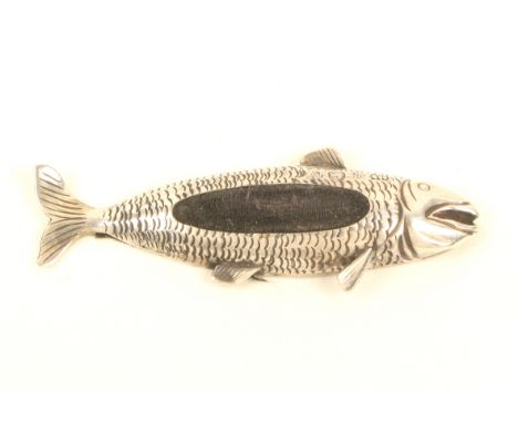 A silver fish form pincushion, the scale form body with raised fins and tail, Birmingham, 1923, maker's mark C U, 7.7cm.