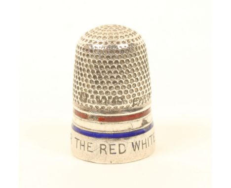 A silver and enamel thimble, 'A Stitch For the Red, White and Blue', minor loss to red, white and blue enamel bands.(From The