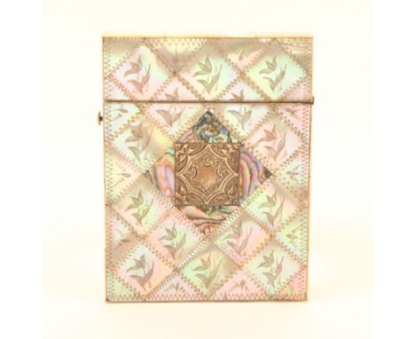 A mother-of-pearl engraved visiting card case, hinged top, the diamond ground engraved with lilies, one side with an abalone 
