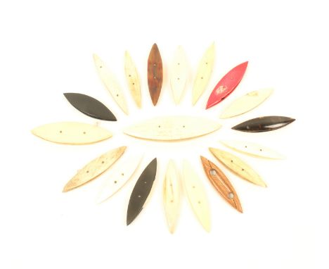 Nineteen tatting shuttles, comprising; thirteen in bone, one red stained, a mother of pearl example and five others, largest 