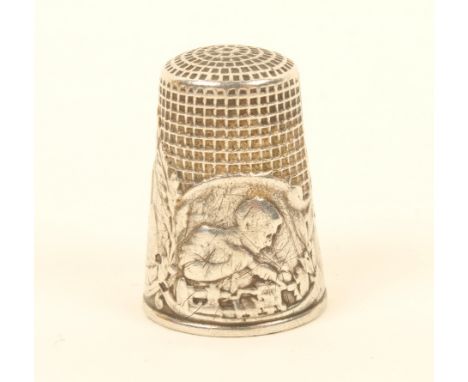 A French silver thimble, 'Thimble of War', with three figural panels, the larger signed 'Lasserre', general scratching.