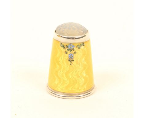 A Norwegian silver thimble, the yellow basse-taille ground with a small grouping of flowers below a moonstone top, marked to 