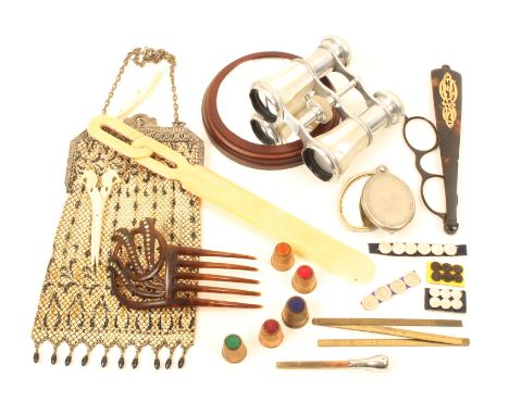 A mixed lot comprising; a pair of opera glasses with mother-of-pearl grips, 11cm, boxed set of four thimbles, hair comb, ivor