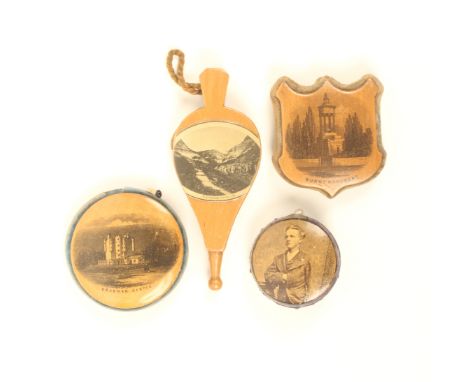 Four Mauchline ware pincushions, comprising; a bellow form example (Blackgang Chine, I.W.), 9.2cm, a shield form example (Bur