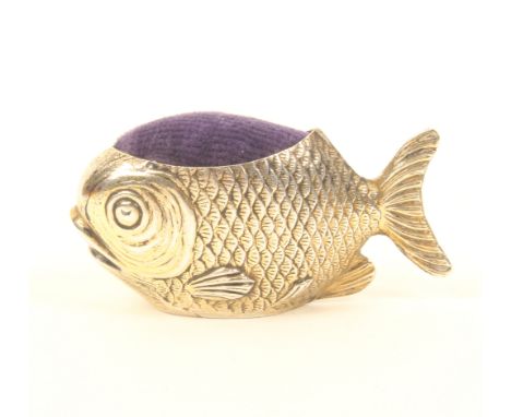An Edwardian novelty silver gilt pincushion in the form of a fish, with blue velvet cushion, by Sampson Mordan & Co., Chester