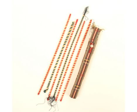 An attractive skein holder in colourful fabric, with button closure complete with paper cased skeins, 19cm, and six straw and