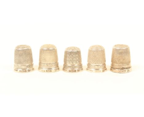 Five silver jewellers thimbles, with raised letter borders, comprising; James Walker The London Jeweller (x2), James Walker W