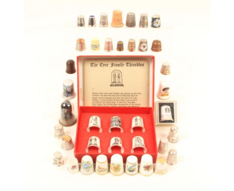 A quantity of thimbles, including a few silver examples, two signed Royal Worcester examples, and a boxed set of six ceramic 