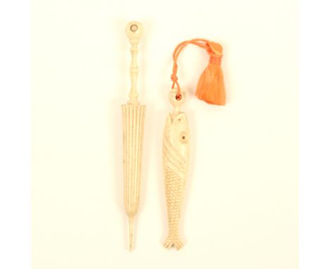 Two bone needlecases, comprising; a fish form example with ball form screw terminal, 7.8cm, and an example in the form of a f