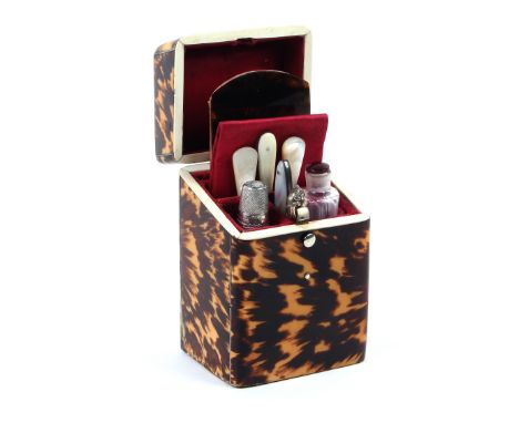 A good 19th century tortoiseshell 'Lady's Companion' of rectangular section, with hinged sloping lid centred by a white metal