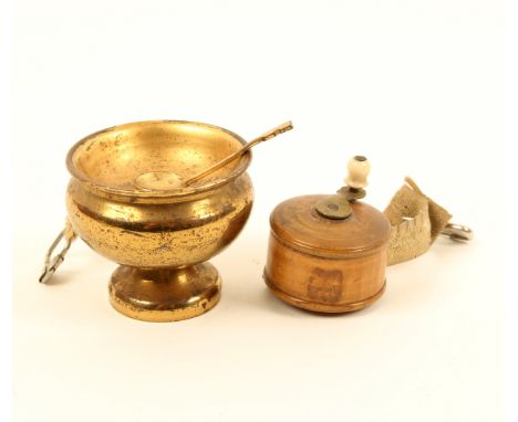 Two tape measures, comprising; a novelty gilt metal example as a bowl of soup with the printed 'Dean' tape wound by the soup 