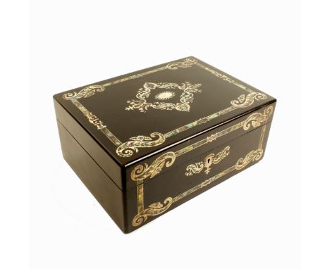A sewing box of rectangular form, circa 1850, the ebonised ground inlaid to the top and front, with cut mother-of-pearl with 