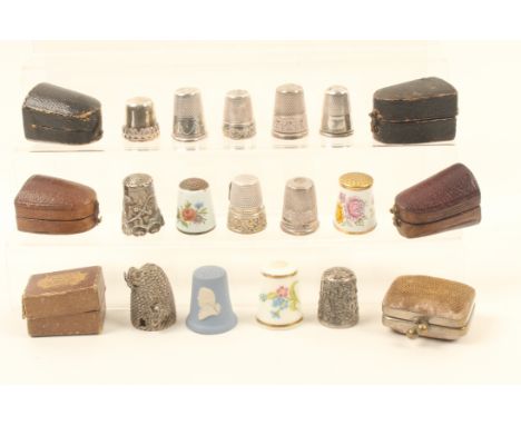 Thimbles and thimble cases, comprising; ten silver or white metal examples, one with enamel shield plaque 'Lichtenstein', two