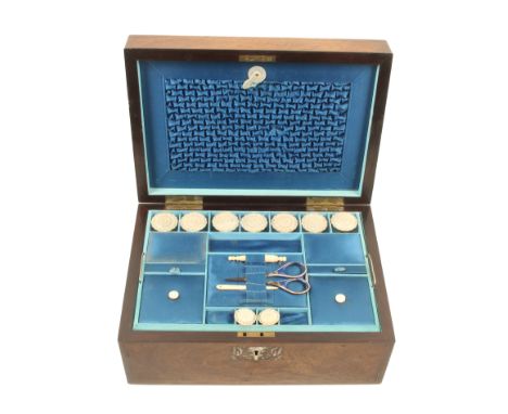 A mid-Victorian rosewood and mother-of-pearl inlaid sewing box, of rectangular form, the front with floral escutcheon and a f