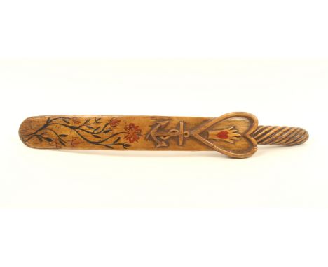 A nautical themed 19th century ash knitting stick, spiral carved mount, the curved blade with a carved heart centred by a han