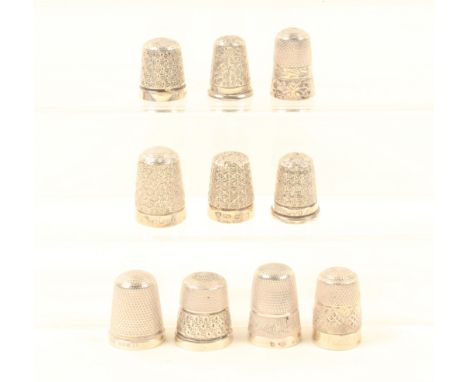 Ten English silver thimbles, most with decorative borders, all hallmarked. (10)